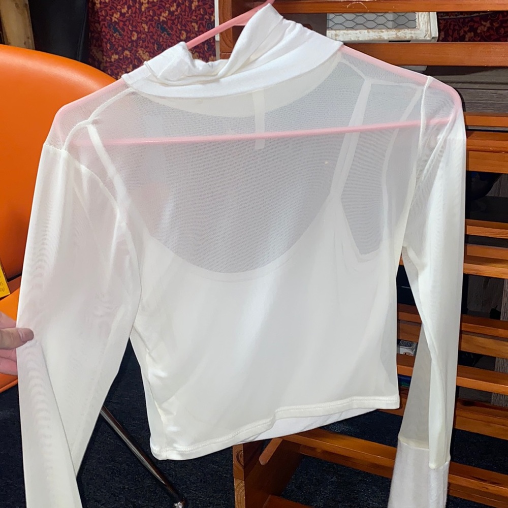 White tank top with attached long sleeve sheer. Fits size small/ medium